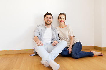 Image showing happy couple at empty room of new home