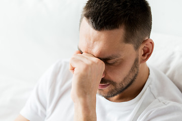 Image showing close up of man in bed thinking