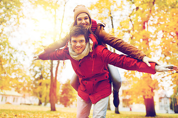 Image showing happy young couple having fun in autumn park