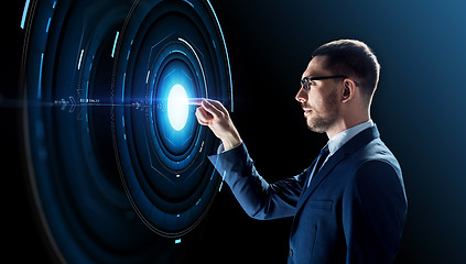 Image showing businessman in glasses with virtual projection