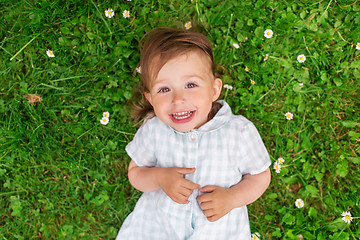 Image showing happy baby girl on green summer field