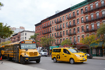 Image showing Yellow school bus and NYC taxi cab