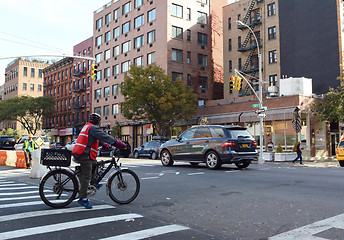 Image showing Delivery cyclist waiting at red light in Hell\'s Kitchen