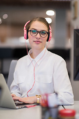 Image showing businesswoman using a laptop in startup office