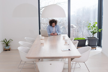 Image showing Young casual businessman using smartphone