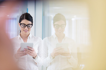 Image showing Business Woman Using Digital Tablet in front of startup Office