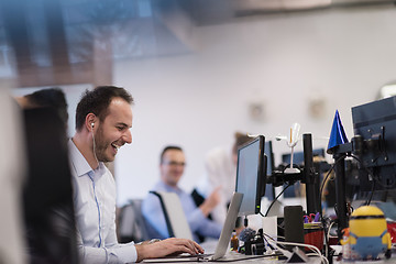 Image showing businessman working using a laptop in startup office