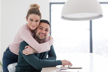 Image showing couple hugging in their new home