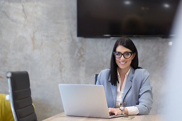 Image showing businesswoman using a laptop in startup office