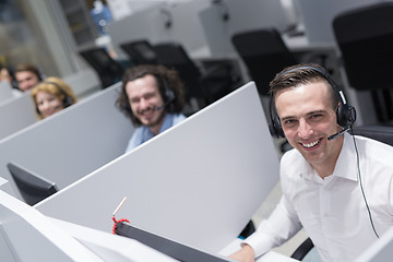 Image showing male call centre operator doing his job