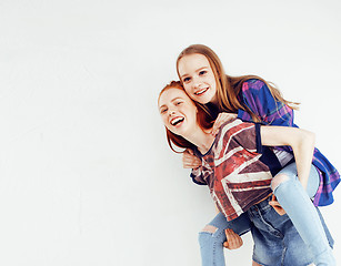 Image showing best friends teenage girls together having fun, posing emotional on white background, besties happy smiling, lifestyle people concept close up. making selfie