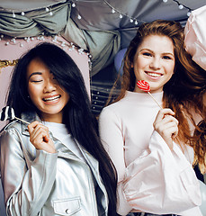 Image showing Lifestyle and people concept: young pretty diversity nations woman with different age children celebrating on birth day party together happy smiling, making selfie. African-american, asian and caucasi