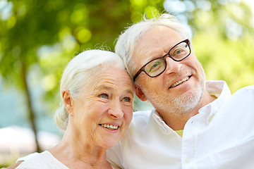 Image showing happy senior couple taking selfie at summer park