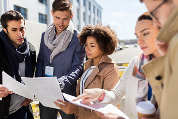 Image showing international business team with papers in city