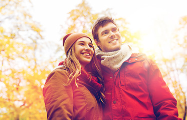 Image showing happy young couple walking in autumn park