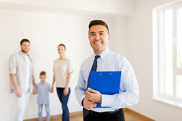 Image showing realtor with clipboard and family at new home