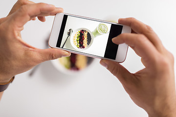 Image showing man photographing healthy breakfast by smartphone