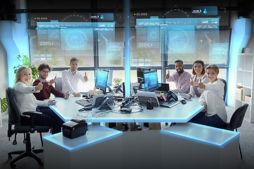 Image showing business team showing thumbs up at office