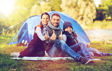 Image showing happy family with tent at camp site