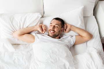 Image showing man lying in bed at home