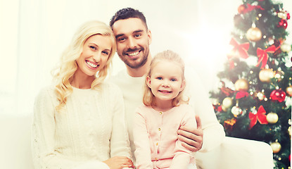 Image showing happy family at home with christmas tree