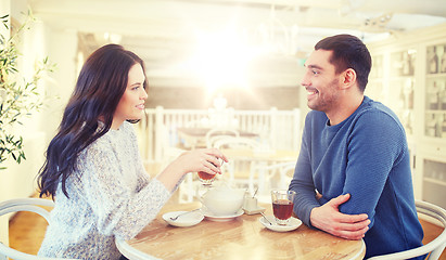 Image showing happy couple drinking tea at cafe