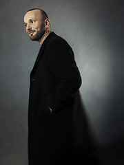 Image showing bearded man in a black coat
