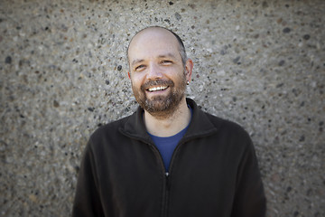 Image showing a male portrait in front of a wall