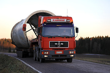 Image showing MAN Truck Hauls Oversize Load on Rural Road