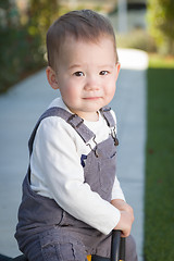 Image showing Young Mixed Race Chinese and Caucasian Baby Boy Having Fun Outdo