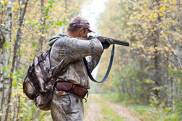 Image showing hunter taking aim from a shotgun in the wildfowl