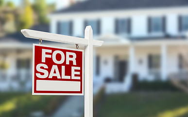 Image showing Home For Sale Real Estate Sign in Front of Beautiful New House.