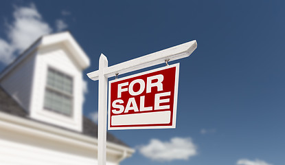 Image showing Home For Sale Real Estate Sign in Front of Beautiful New House.