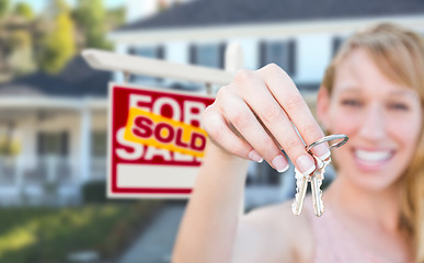 Image showing Excited Woman Holding House Keys and Sold For Sale Real Estate S