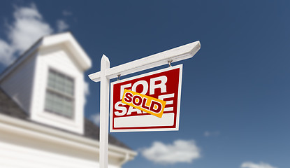 Image showing Sold Home For Sale Real Estate Sign in Front of Beautiful New Ho