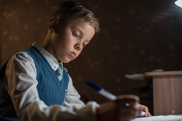 Image showing pupil boy does his homework