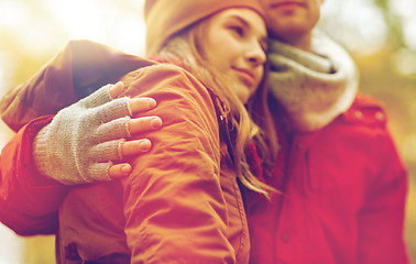 Image showing close up of happy couple hugging in autumn park