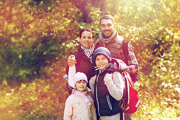 Image showing happy family with backpacks hiking