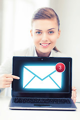 Image showing businesswoman with laptop in office