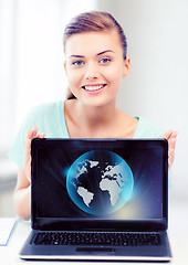 Image showing woman with laptop and sphere globe