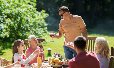 Image showing happy family having dinner or summer garden party