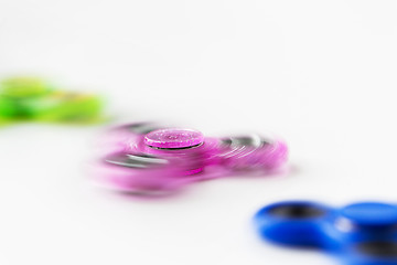 Image showing close up of spinning fidget spinners