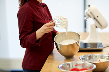 Image showing chef with whisk and whipped egg whites at kitchen