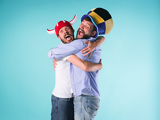 Image showing Two Excited Male Friends Celebrate Watching Sports