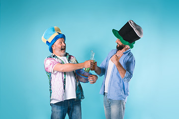 Image showing The two football fans over blue