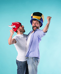 Image showing Two Excited Male Friends Celebrate Watching Sports