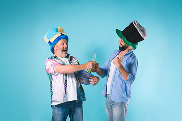 Image showing The two football fans over blue