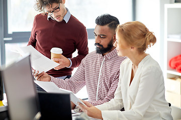 Image showing business team with tablet pc in office