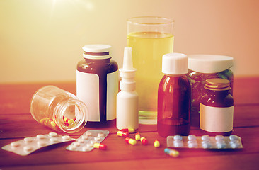 Image showing medicine and drugs on wooden table