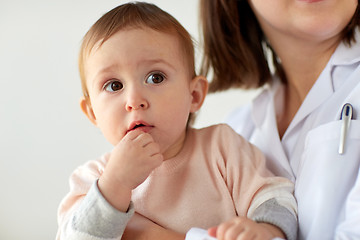 Image showing doctor or pediatrician with baby on medical exam